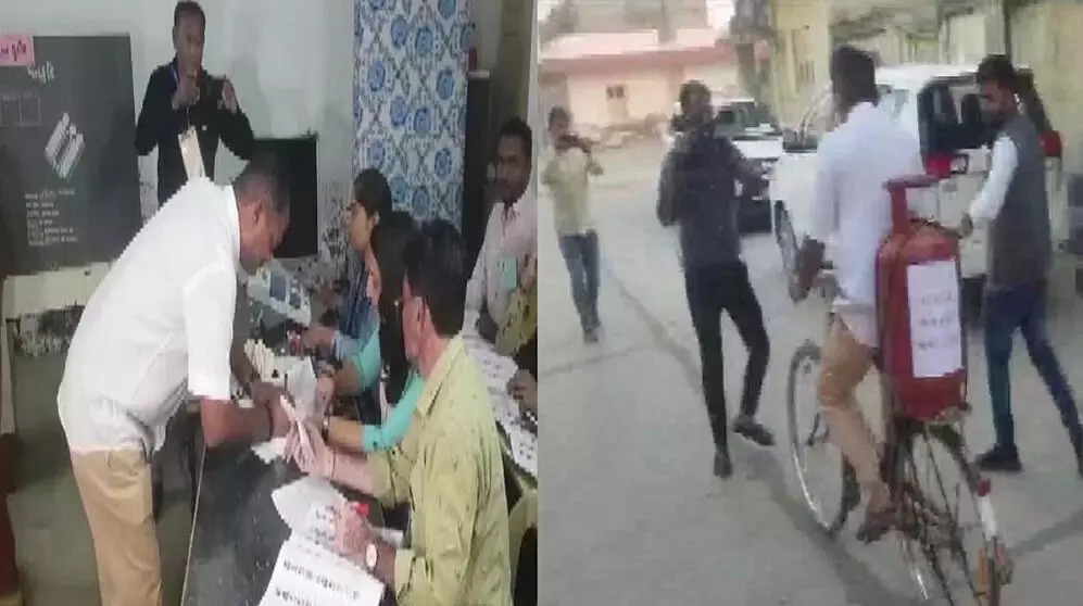 गुजरात चुनावः कांग्रेस उम्मीदवार साइकिल पर गैस सिलेंडर लेकर वोट डालने पहुंचे गुजरात चुनावः कांग्रेस उम्मीदवार साइकिल पर गैस सिलेंडर लेकर वोट डालने पहुंचे